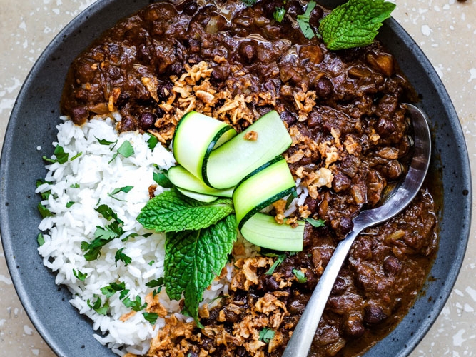 Black Chickpeas curry in a bowl with spoon
