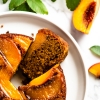 Upside down peach cake with a slice open