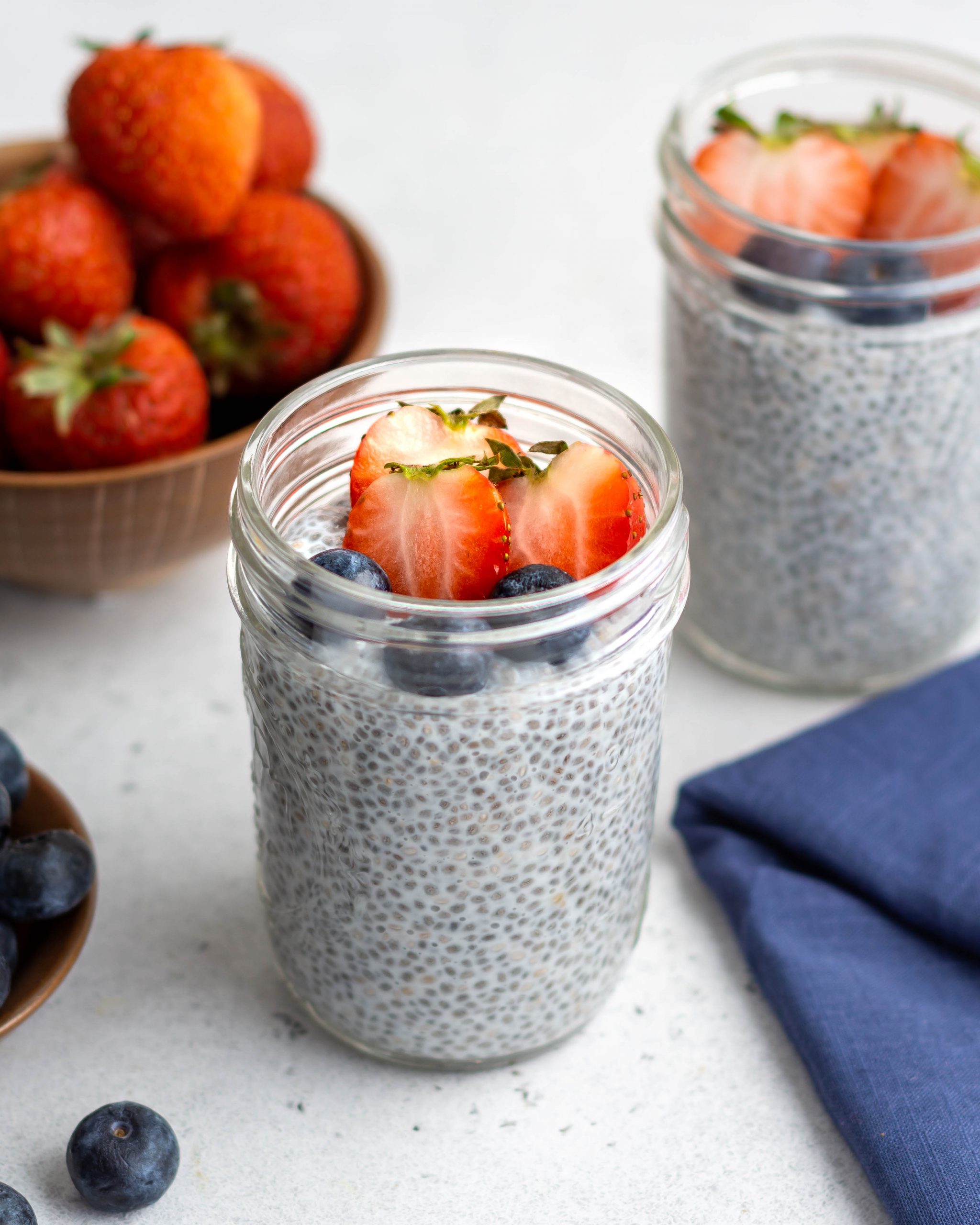 chia pudding in a glass jar with fruits
