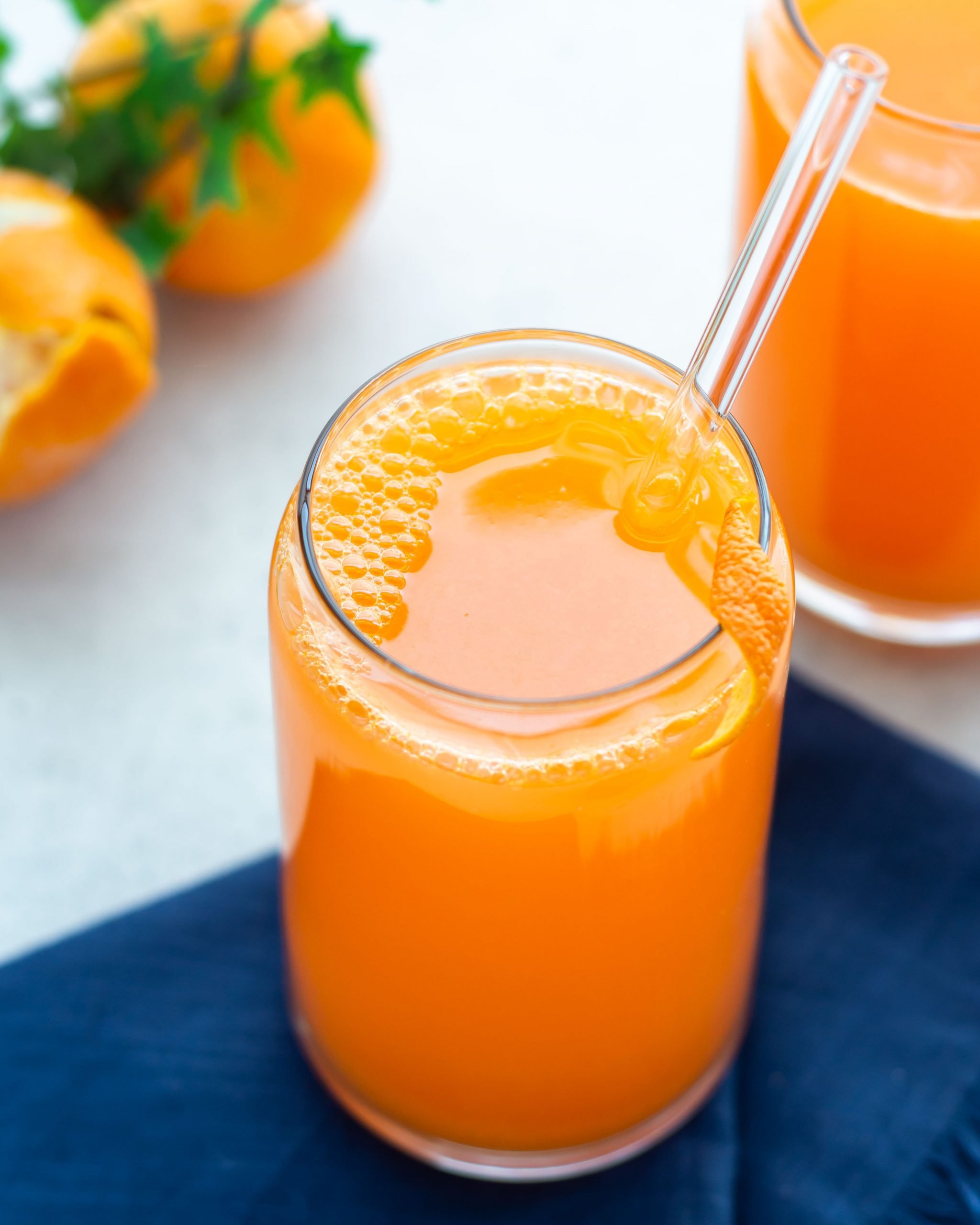 orange ginger detox juice in a glass