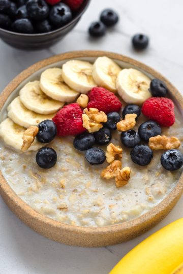 vegan microwave oatmeal in a bowl with fruits
