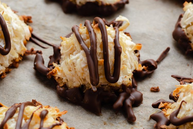 vegan and gluten-free healthy coconut macaroons lined on a parchment paper