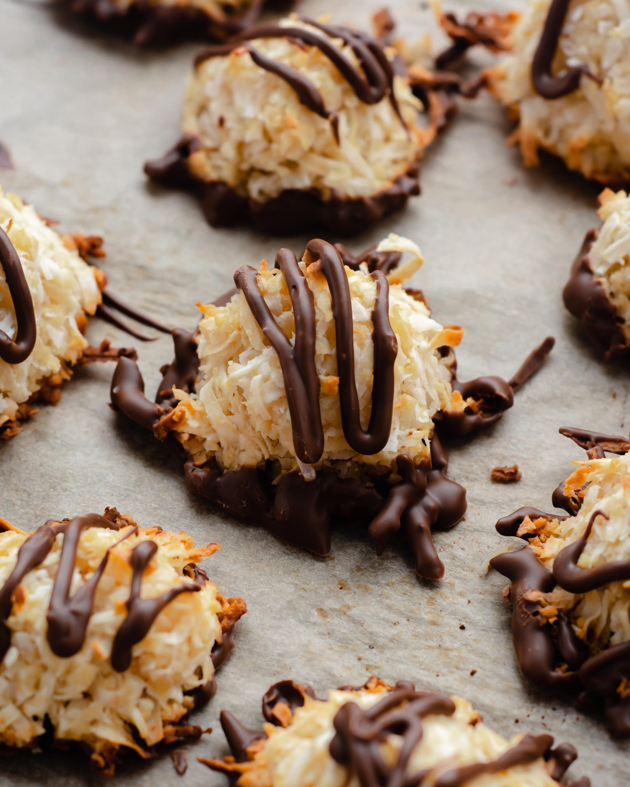 vegan and gluten-free healthy coconut macaroons lined on a parchment paper