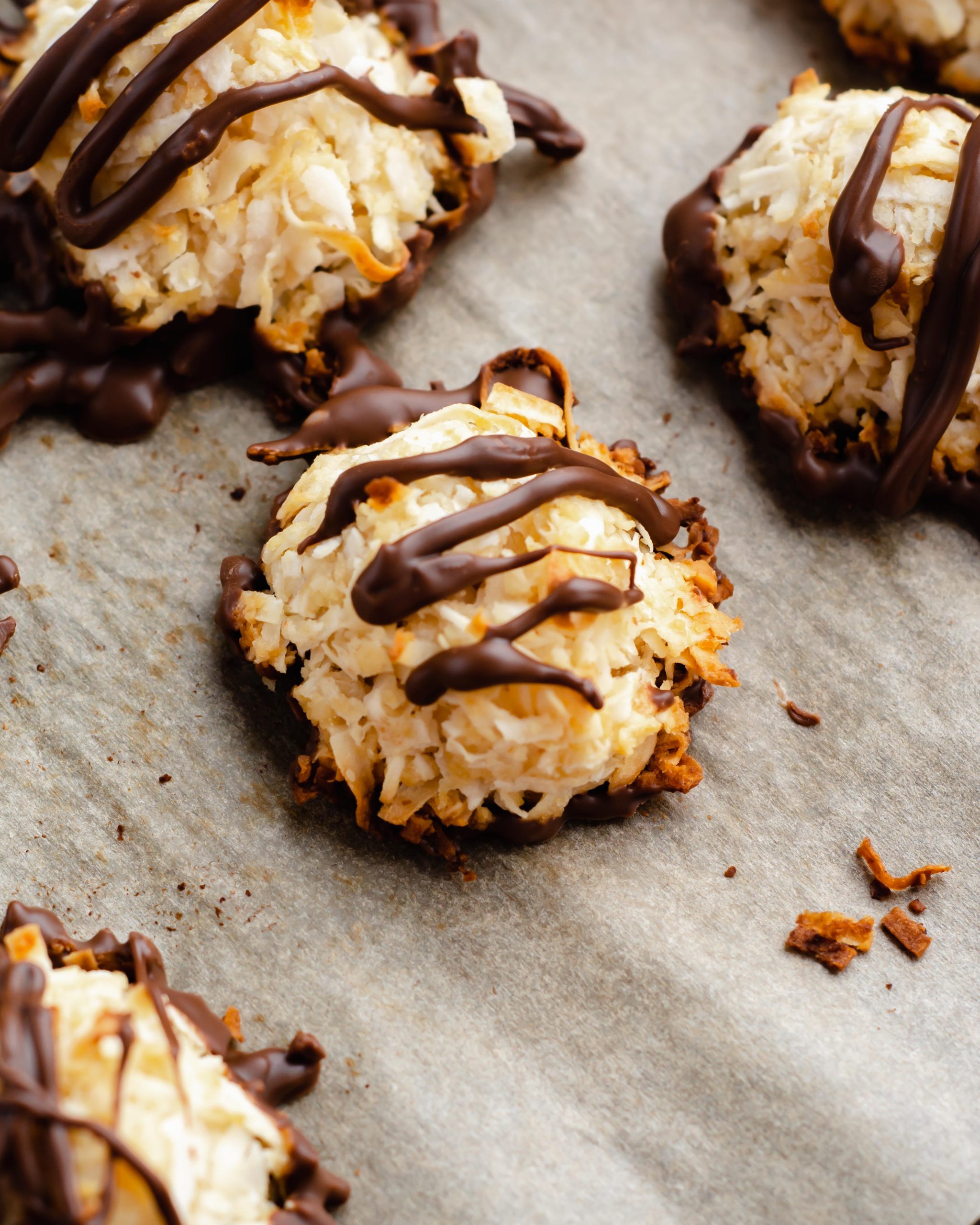 healthy sugar-free coconut macaroons with drizzle of melted chocolate.